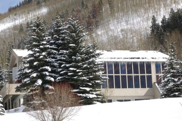 Golfer with Prosethetic Leg posing mid-swing with friend